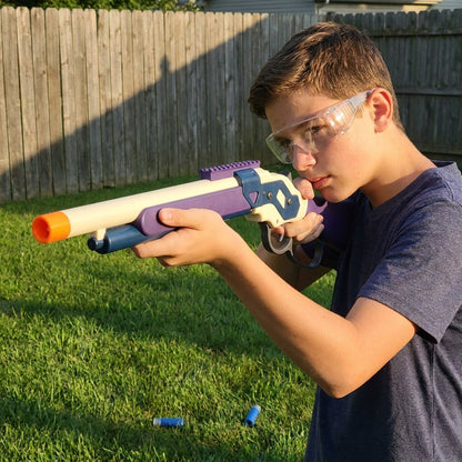 Teen aiming the Ranger 1887 Shellblaster in a backyard