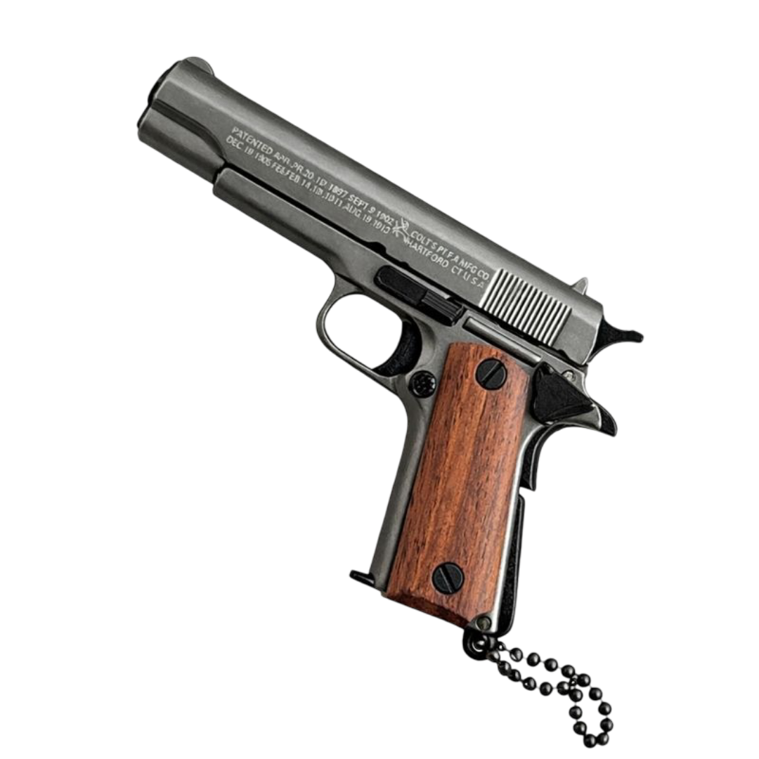 Miniature metal Colt 1911 pistol keychain with wooden grips and detachable ring